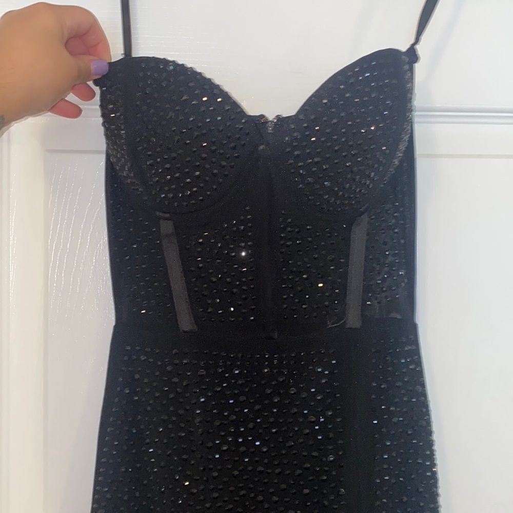 Strapless floor length beaded gown. Corset top with zipper. Size small.